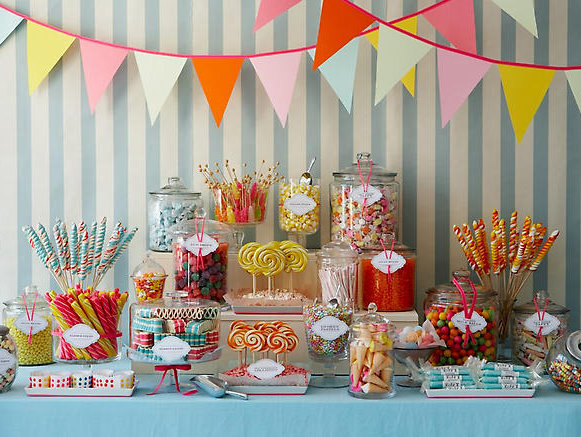 Show off your wedding cake on a table full of other candies 