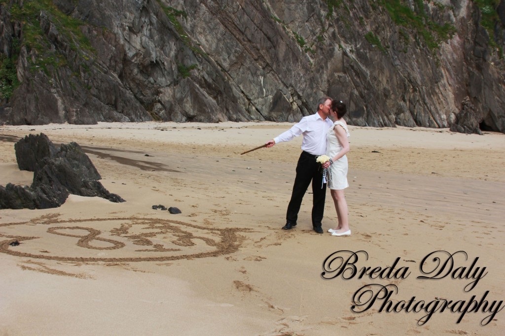 Most Intimate Wedding writing in the sand