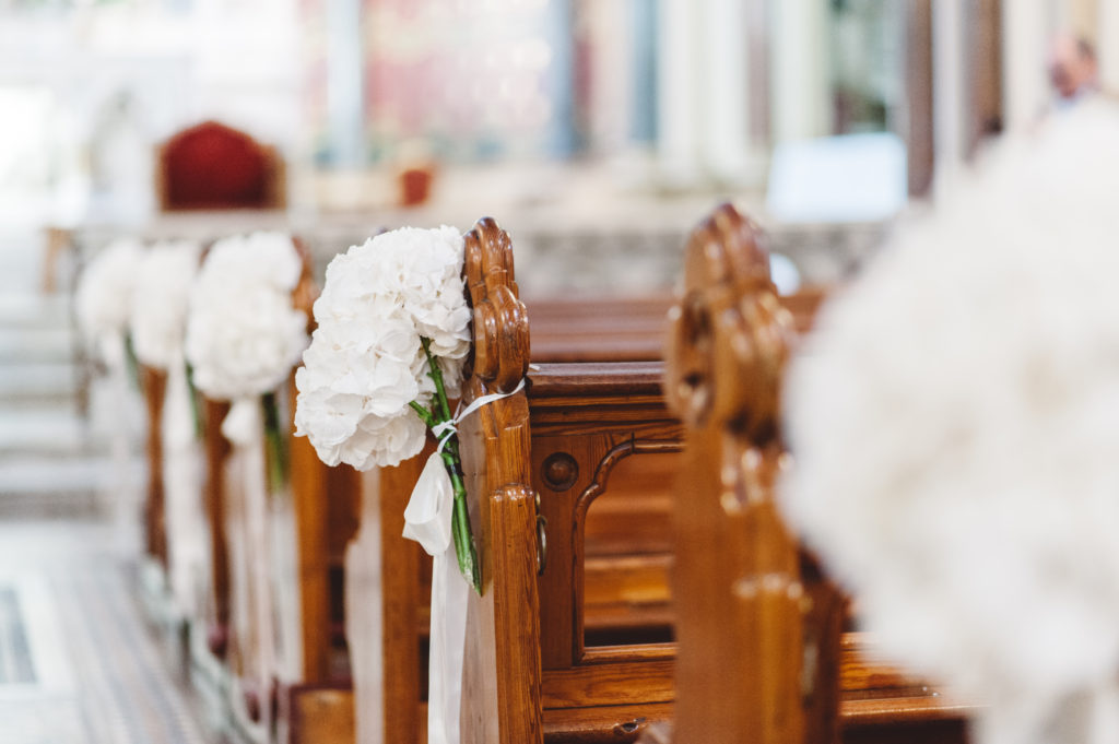 white hydrangea Pew ends wedding church