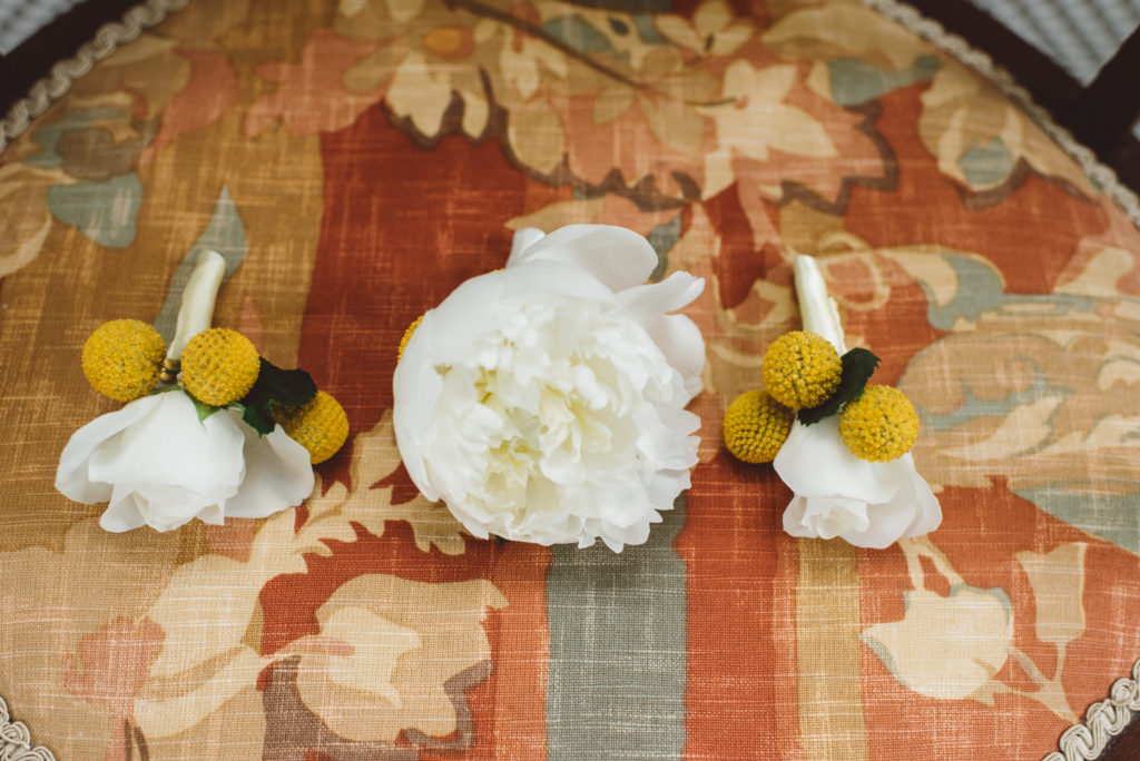 Yellow and white grooms boutonnieres