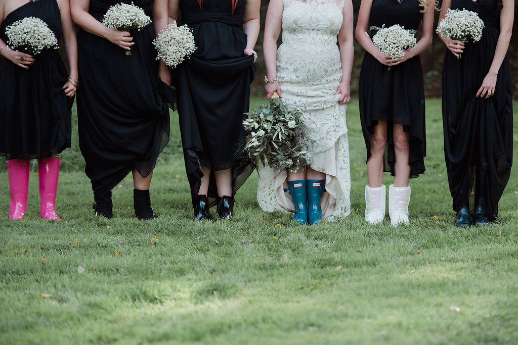 destination wedding in a barn Aislinn Events bridal party in welly boots