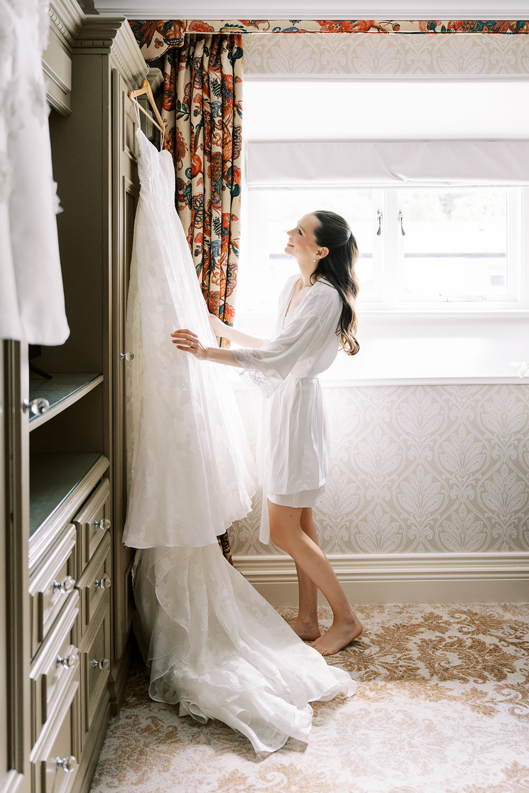 Bride looking at her dress before the big events at Dromoland Castle Hotel