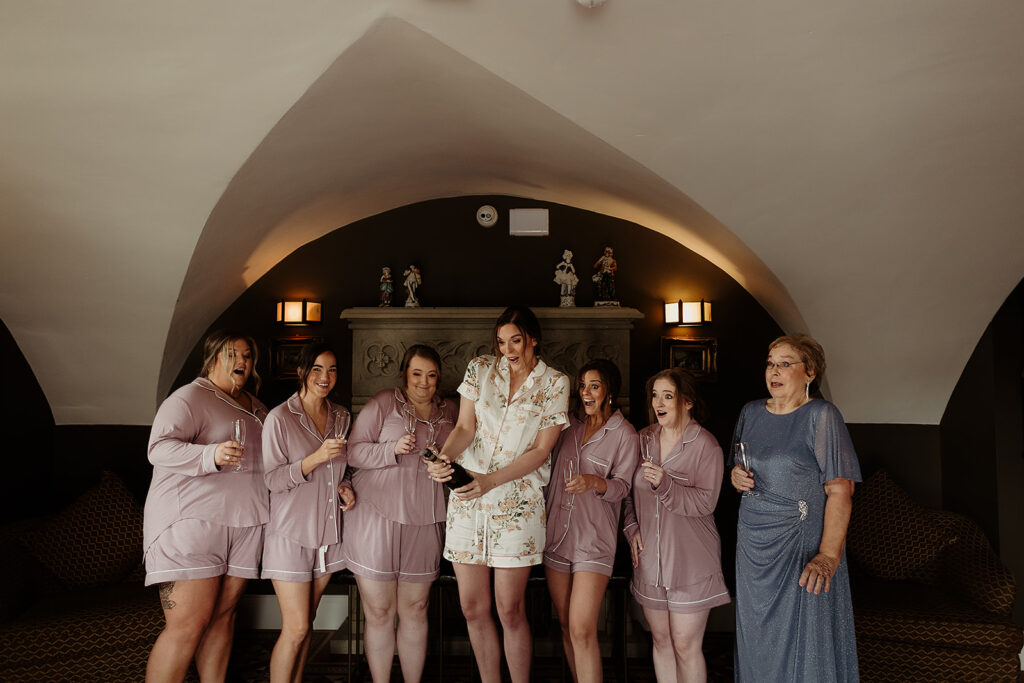 Bride and wedding party enjoying a glass of Prosecco in the morning before the big day