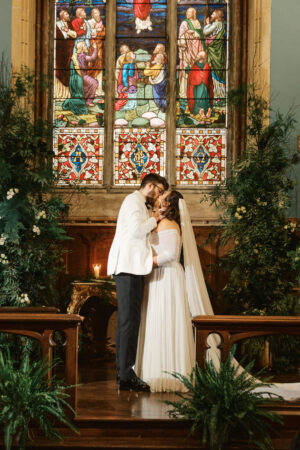 bride and groom kissing in the chapel at Markree castle