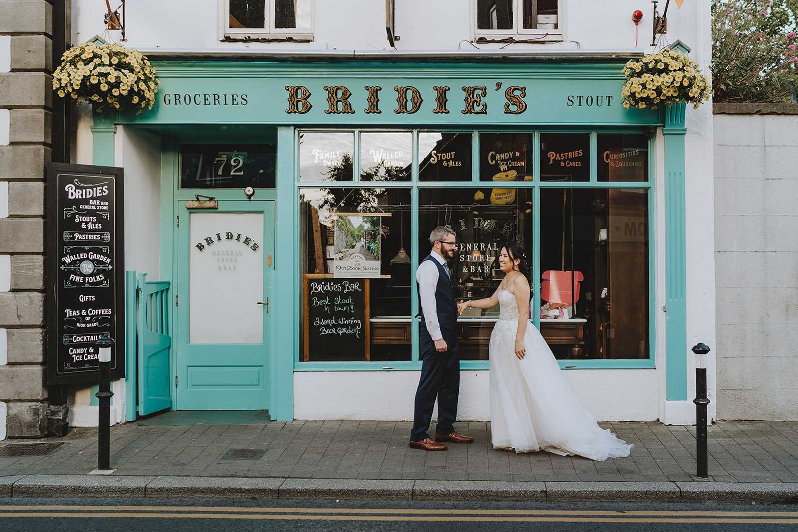 bride and groom outside bridies bar Langtons Killkenney
